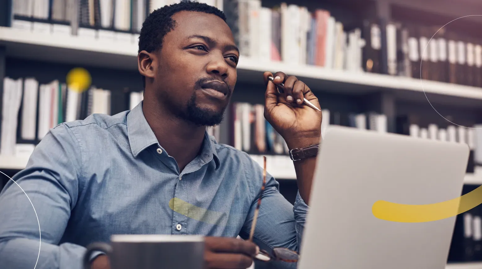 An adult learner working on a laptop at home