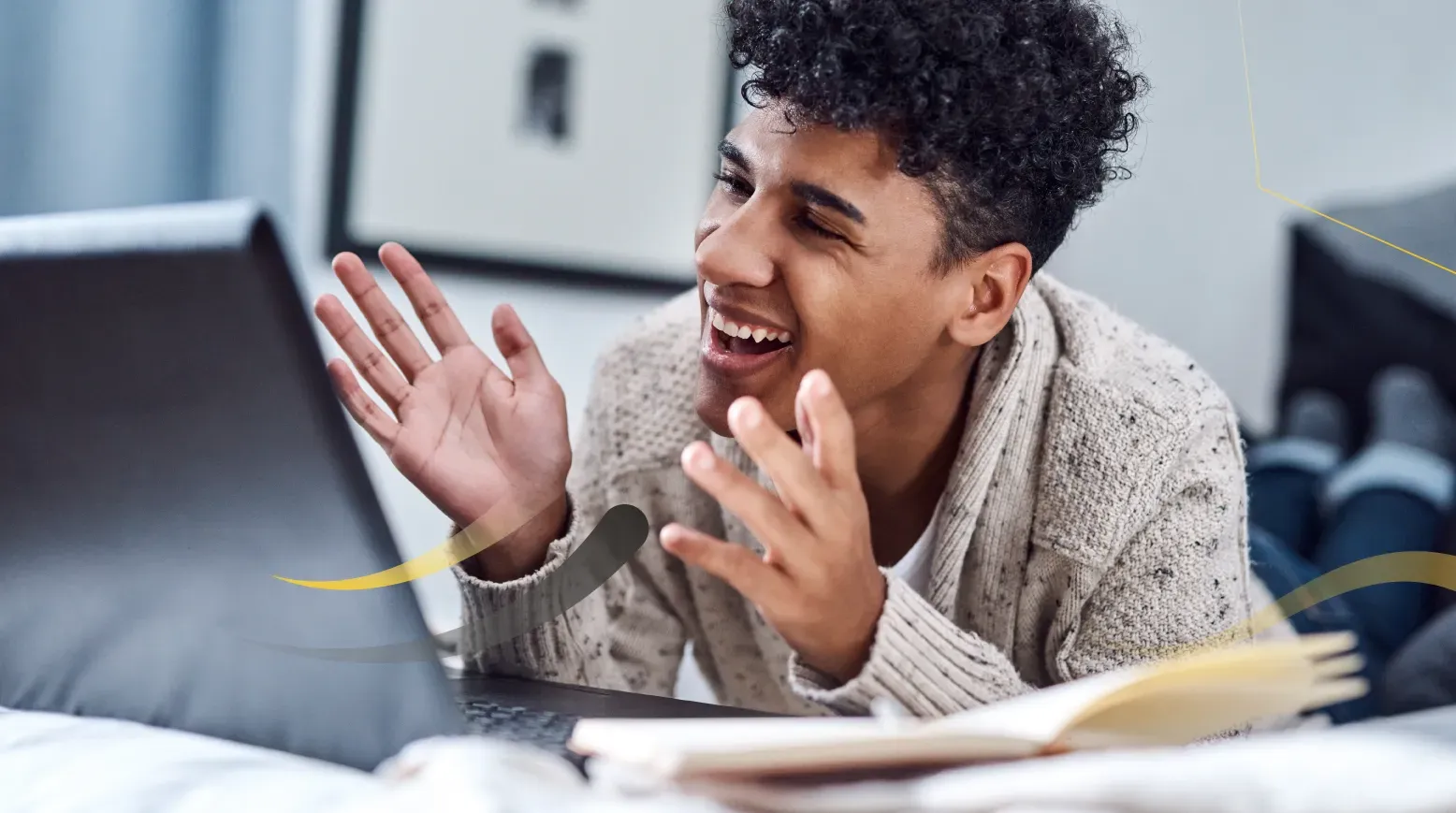 A learner laughing during an online lesson on a laptop