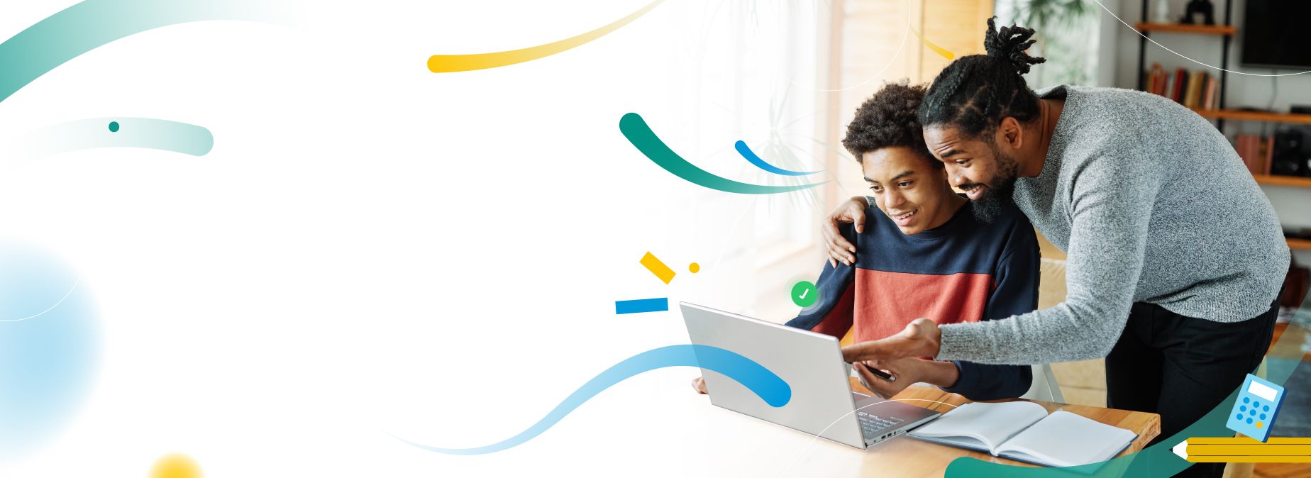 A guardian helping a learner with work on a laptop
