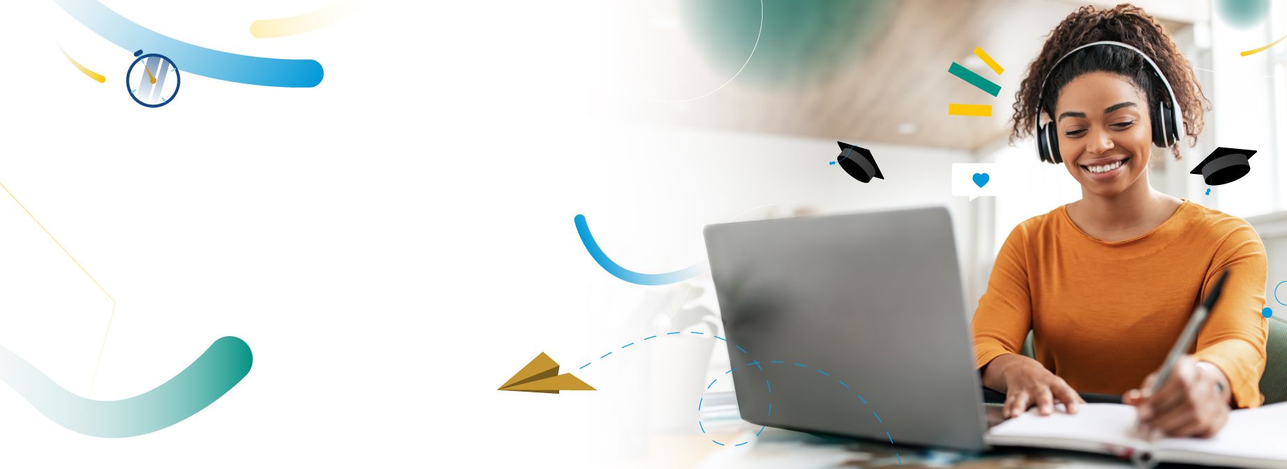 A smiling learner wearing headphones working on a laptop