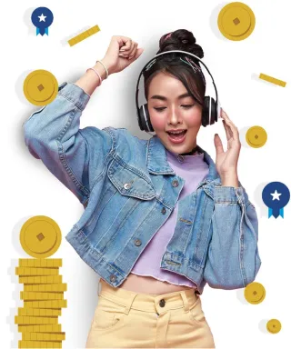 A learner wearing headphones celebrating next to a stack of coins