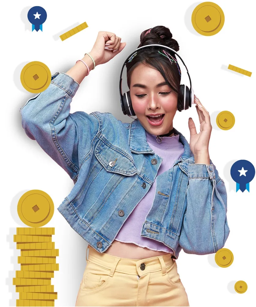 A learner wearing headphones celebrating next to a stack of coins