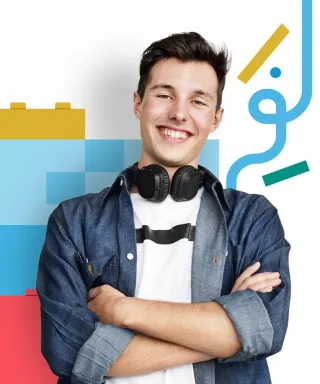 A smiling learner with headphones around his neck